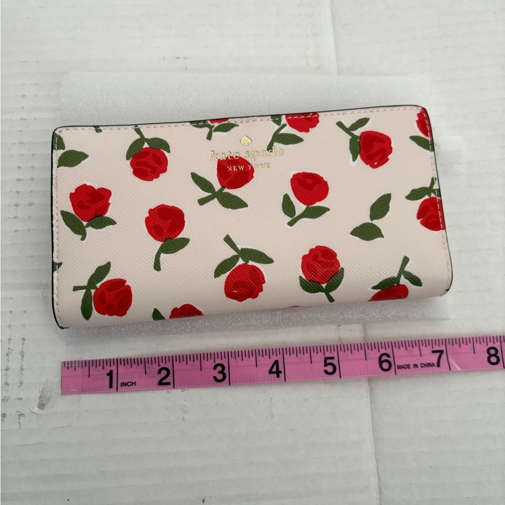 NWT Kate Spade Dana Festive Rosette slim bifold wallet